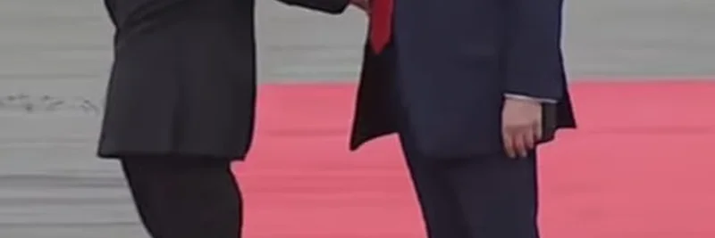 Trump's Pull-In Handshake Meme Goes Viral: Blending Politics and Crypto Humor